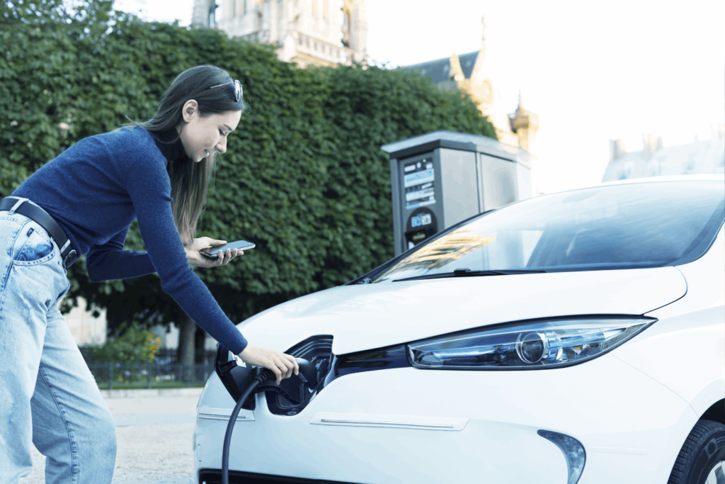 human-hand-is-holding-electric-car-charging-connect-electric-car (1)